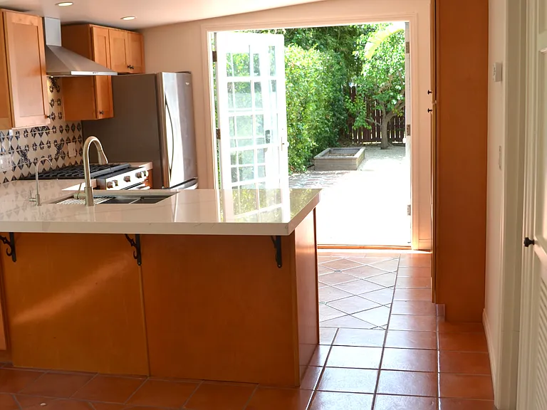 Kitchen flows onto garden patio.