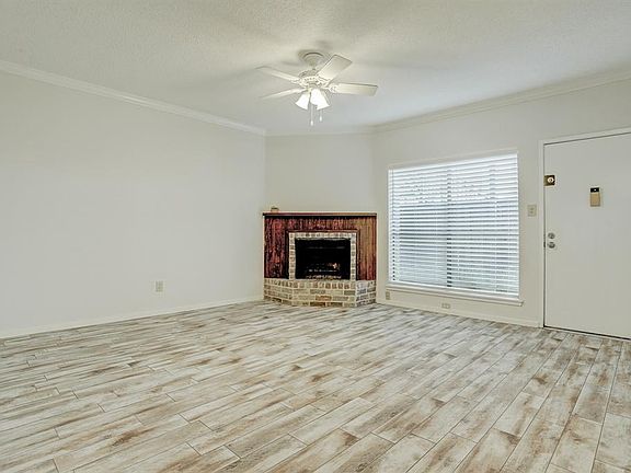 Fireplace in front corner provides character and charm to the room.