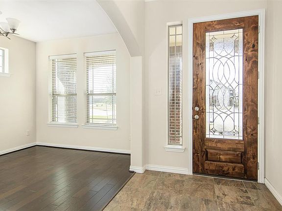 Freshly stained front door and light and bright entry way.