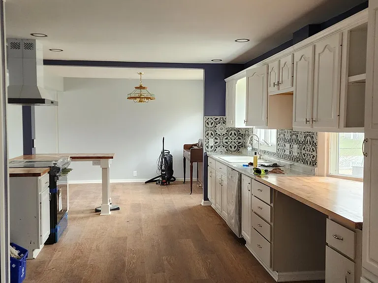 The kitchen complete. lots of natural light, new appliances, coffee area, peninsula, cabinets galore, new appliances, new flooring, etc
