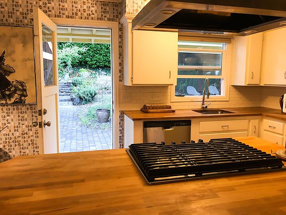 Main floor: Kitchen leading to backyard