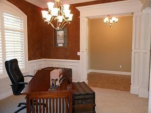Formal Dining: Crown molding, wainscoting and custom-made Plantation shutters...