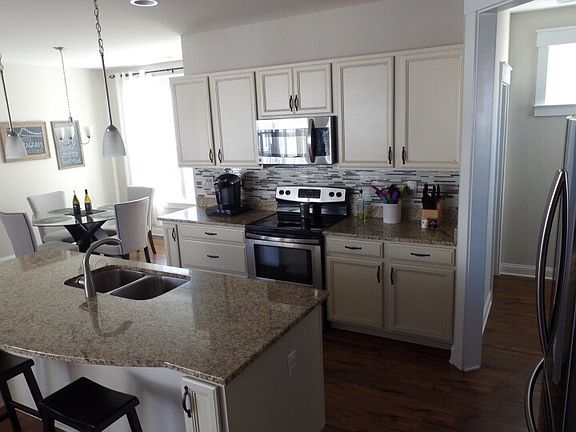 Upgraded cabinets & granite.