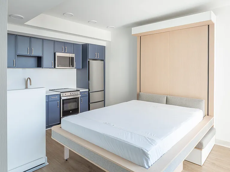 The Ori Cloud Bed lowers with ease, turning the living area into a comfortable bedroom at night.