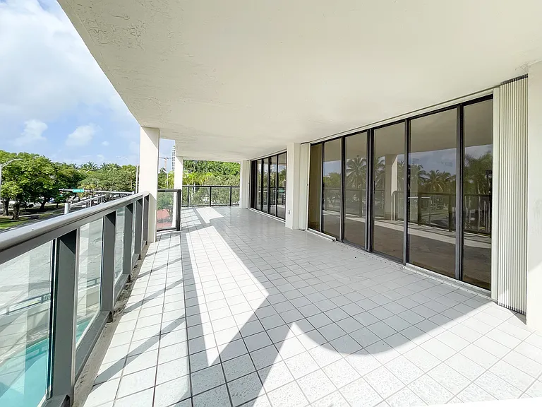 Hurricane shutters protect all the floor to ceiling windows.