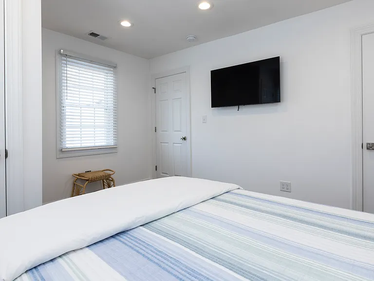 Each bedroom has a tv.