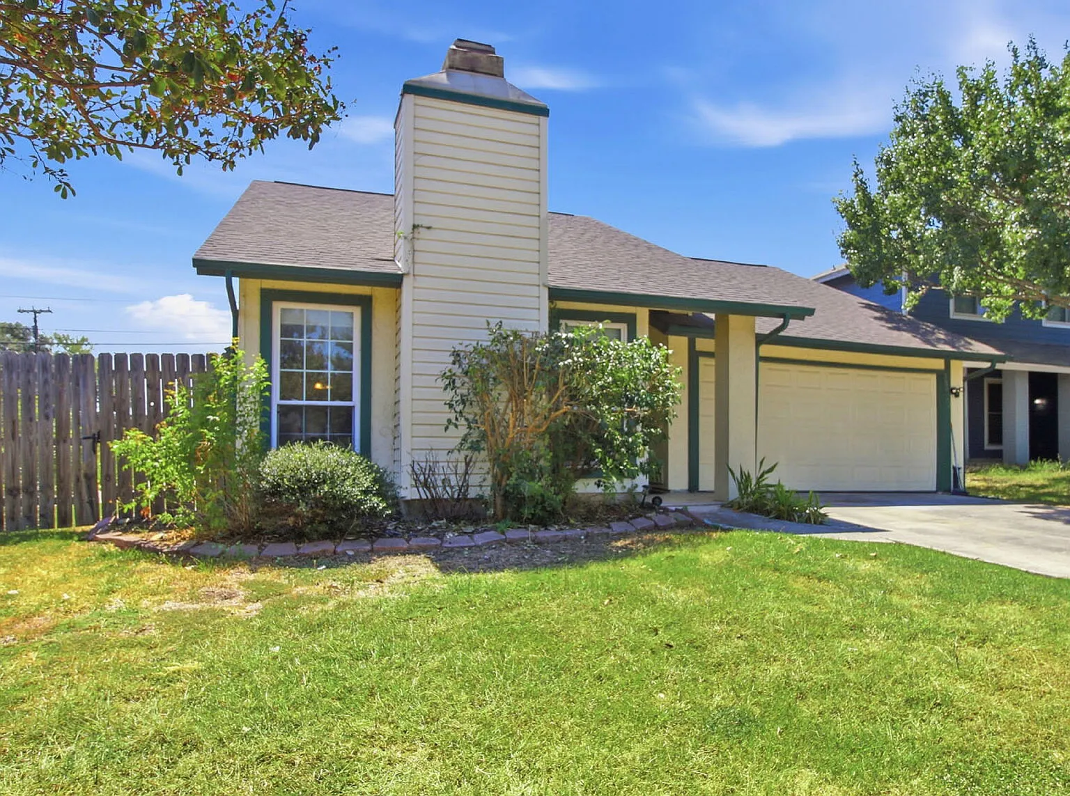 Corner-Lot Garden Home with Fireplace and Private Patio — Photo 1