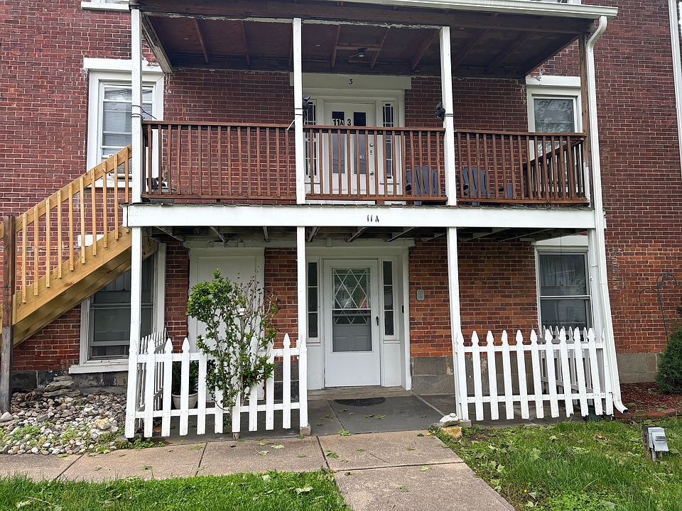 This is the ground floor unit with a white picket fence.