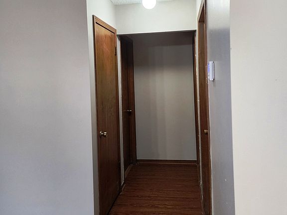 Hallway with linen closet.