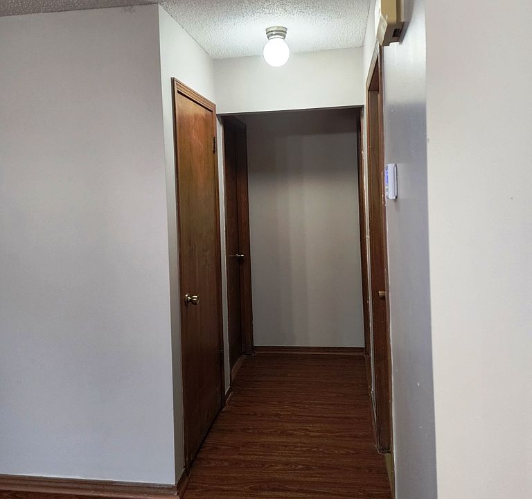 Hallway with linen closet.