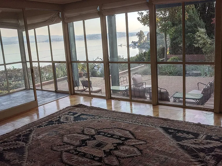 Dining room view to Mt Rainier over back patio. Furniture has been removed