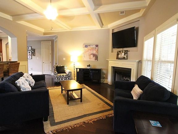 Spacious Living Room with Coffered Ceilings
