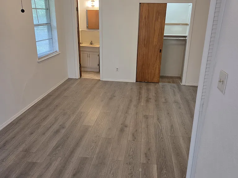 The room actually has three closets and has new flooring which have just been installed.