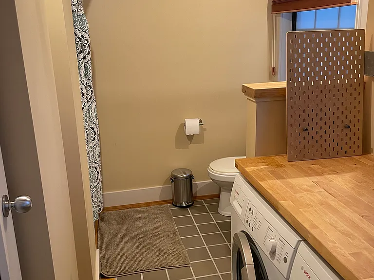 second bathroom with washer and dryer