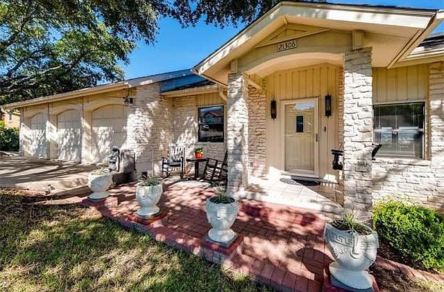 Sitting at the highest point on High Rd, is our all stone home, with 3 car garage, storm door and a terrific views of the lake from almost every room inside.