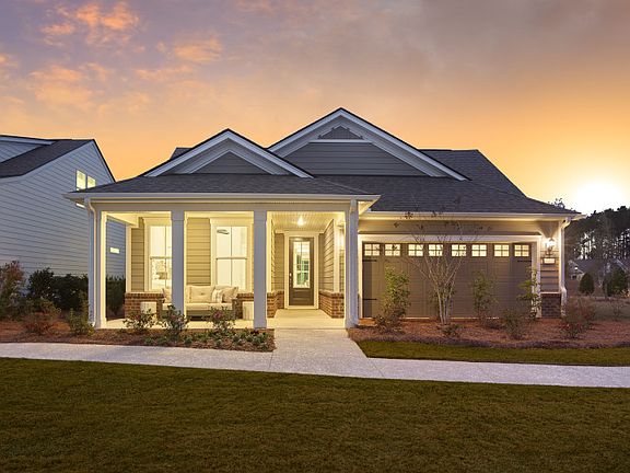 Palmary Exterior with stone accent and a two car garage.