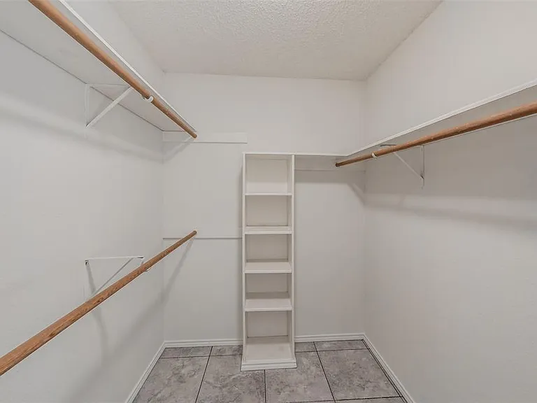 PRIMARY BEDROOM WALK-IN CLOSET