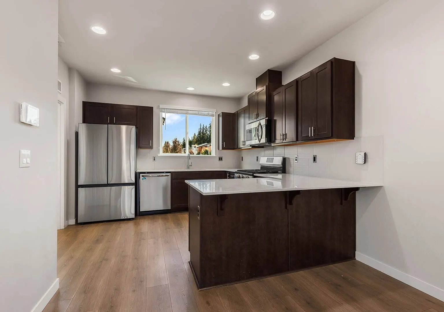 Modern Northshore Townhome with Designer Finishes & 2-Car Garage — Photo 4