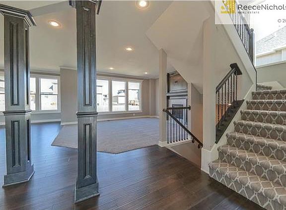 Pre-finished Hand-scrapped hardwood floors in entry, kitchen, breakfast area, and mudroom.