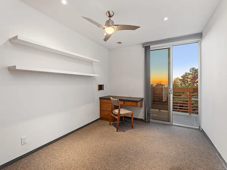 Bedroom with built in desk views looking west