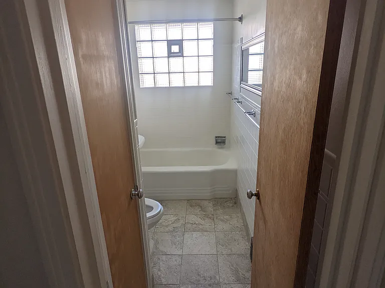 Upstairs Bathroom, tons of natural light and towel closet