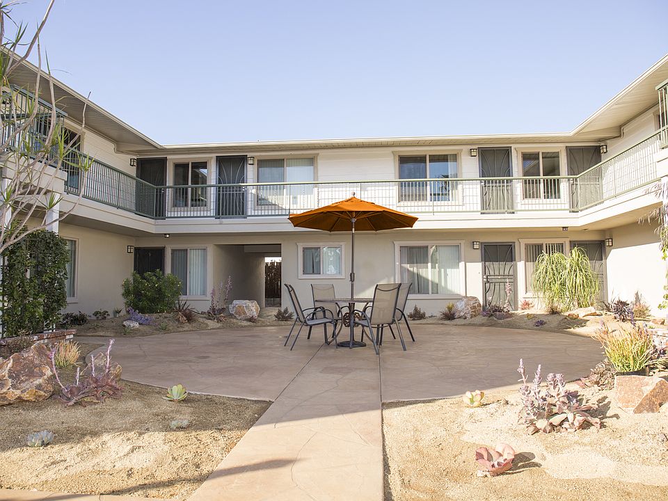 Courtyard view of second floor units at Harbor Villa Apartments in San Diego, California.