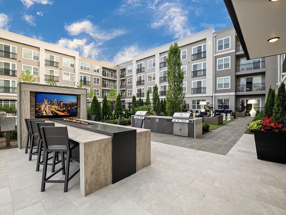 Outdoor dining areas equipped with chef-grade gas grilling stations