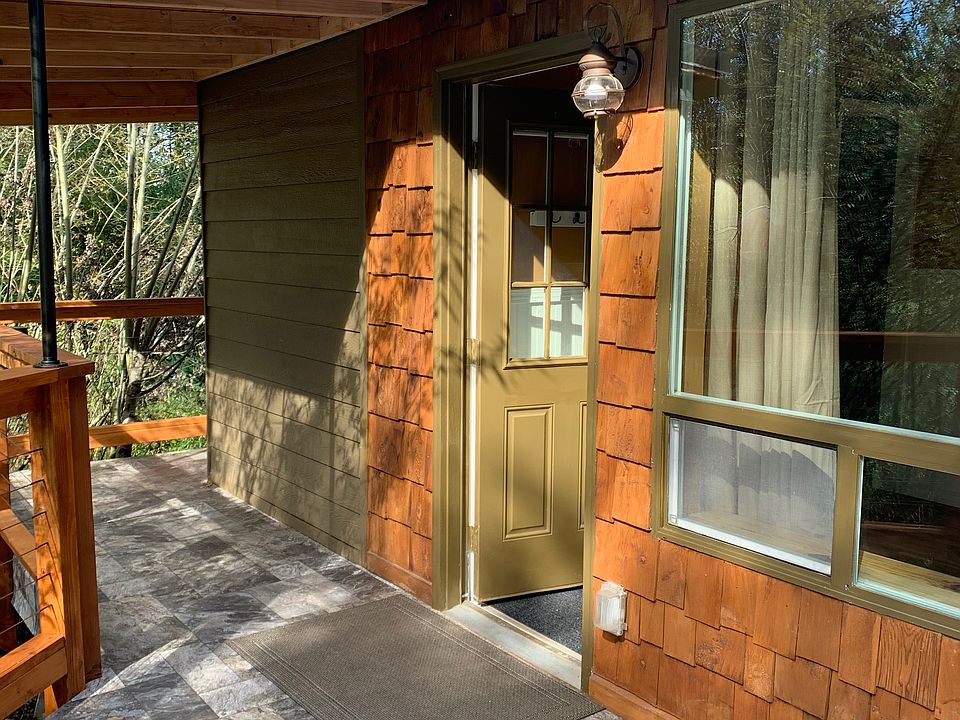 Main entrance from deck facing the view.