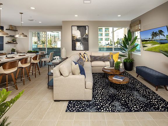 In this open and interconnected space, the kitchen dining room and great room come together to offer