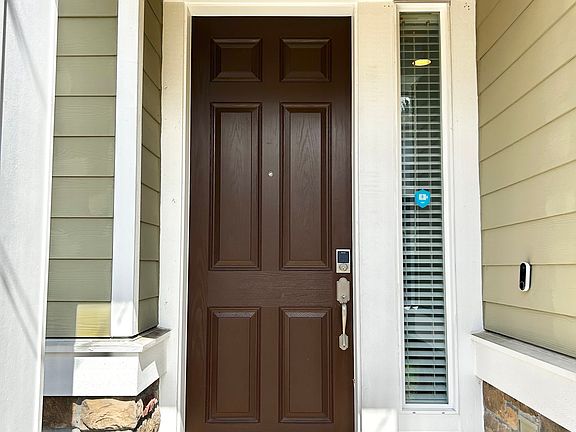 Extra tall front door greets you into the front entrance of your home.