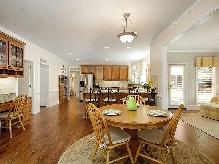 View of Breakfast Area, Sun Room (with Entry to Patio) and Kitchen