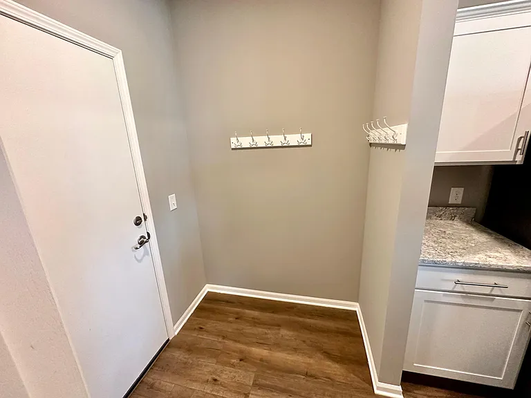 Mud room across from kitchen and pantry
