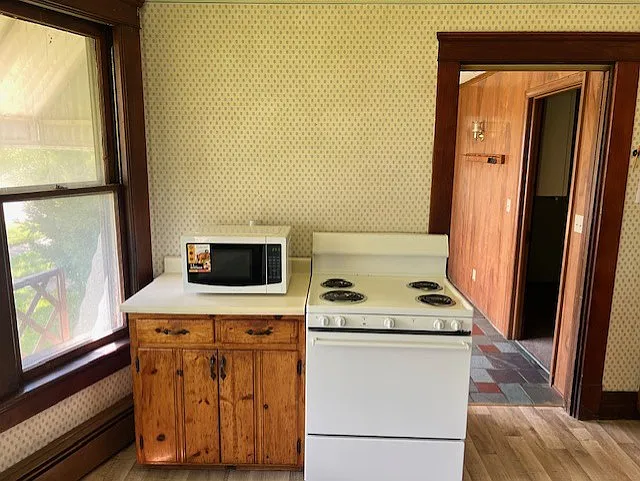 Kitchen view with new Microwave and Stove.