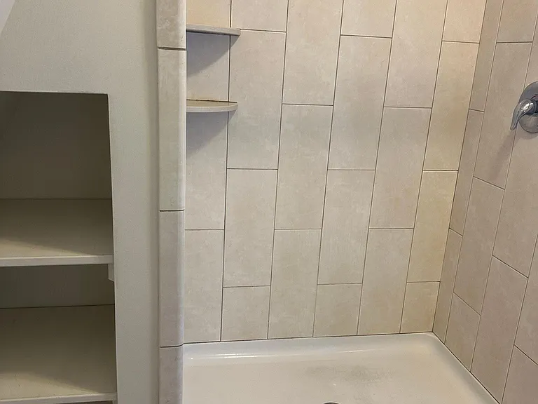 Shower stall & shelving in Bathroom