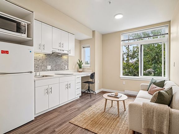 A built-in desk under the window makes room to work without giving up the living area.