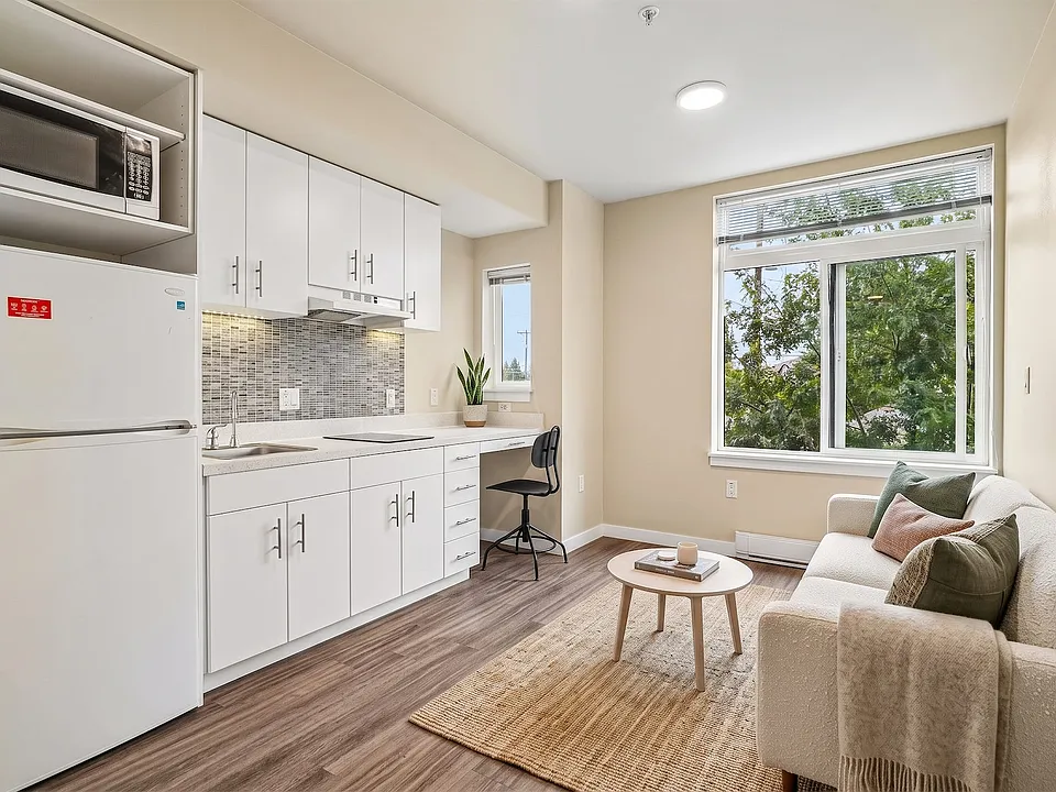 A built-in desk under the window makes room to work without giving up the living area.