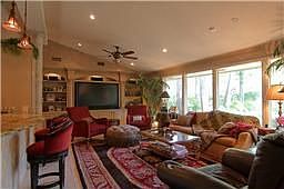 Another view of living room and entertainment center with surround sound.