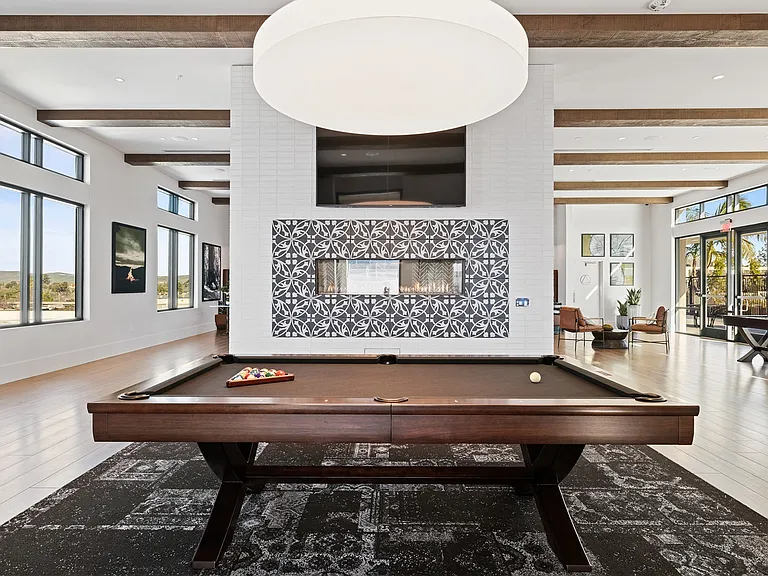 Unwind with a game of pool in this stylish, light-filled lounge.