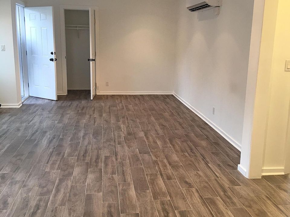 Spacious living room with recessed lights. A/C