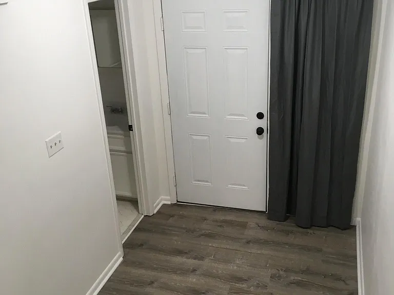 Half bath is next to the downstairs front door. You may use the curtains if you like.