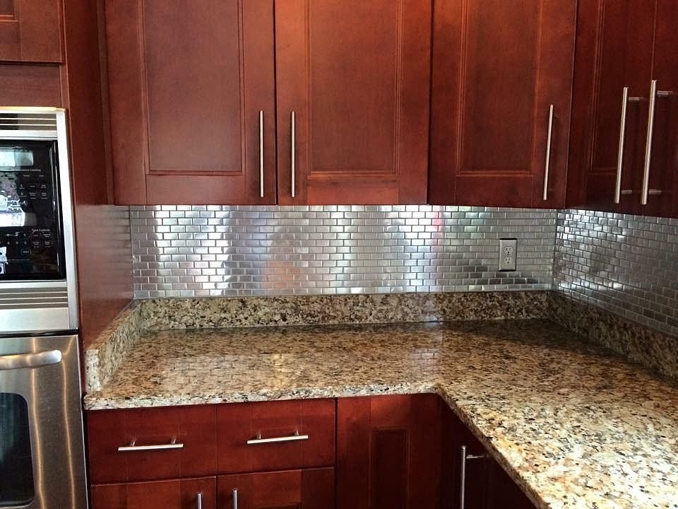 Metal mosaic tile backsplash