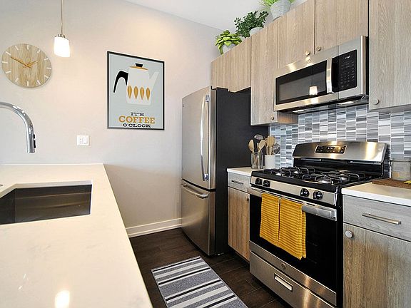 3rd Floor w/ Custom Backsplash - Light Wood Finish