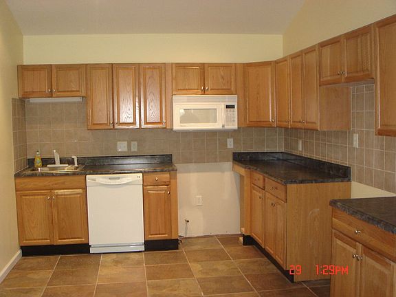 new kitchen cabinets, appliances and ceramic floor
