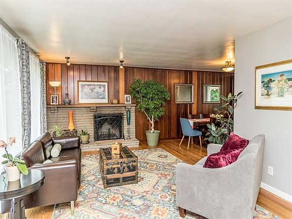Spacious living room with genuine hardwoood floors.  This is what you see upon entering the home (not a staircase!).  Note dinin