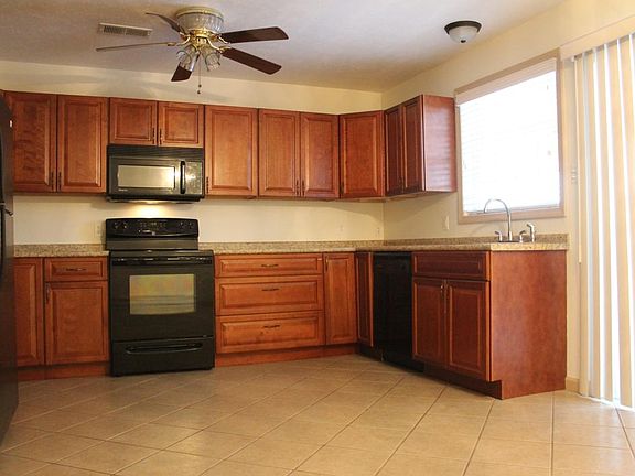 Cherry Cabinets, Higher End Appliances with Dishwasher and P