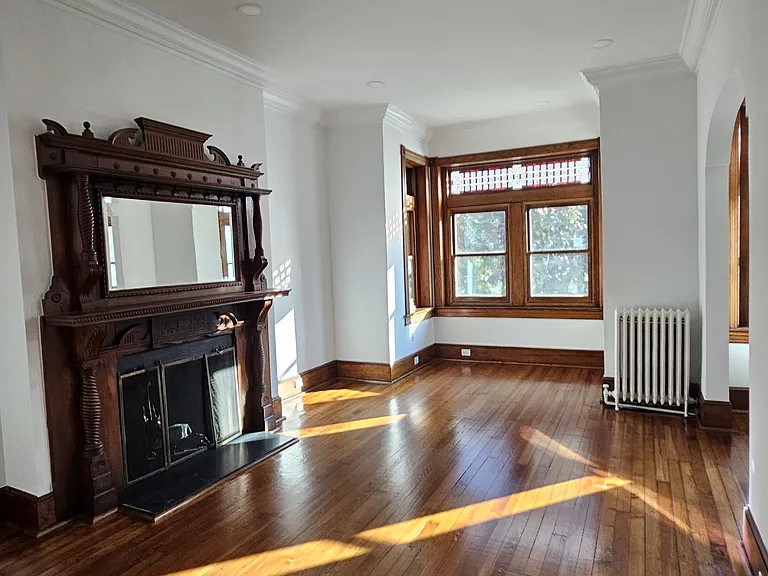 2nd floor suite: front private living room with fireplace, facing south.