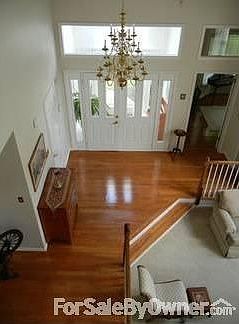 Entry with vestibule : Vestibule (7x9 tiled floor) with skylight opens to foyer with cathedral ceili