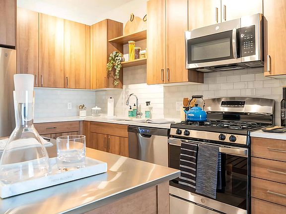 Gourmet Kitchen with Stainless Steel Appliances and Wood Cabinets