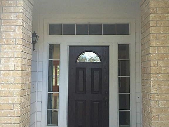 Enter your home through this lovely covered porch.