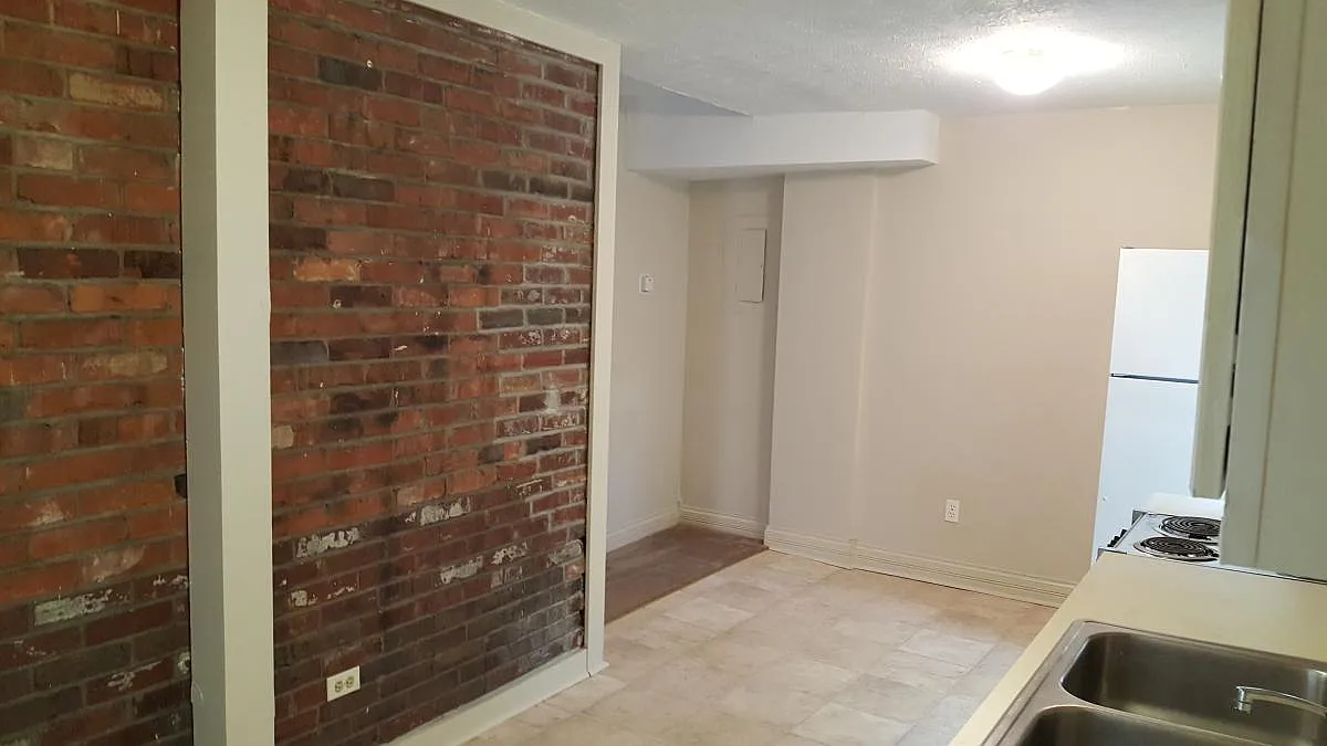 Kitchen - original brick accent - 1320 S Floyd St #4